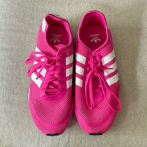 Pink stripped Adidas tennis shoes